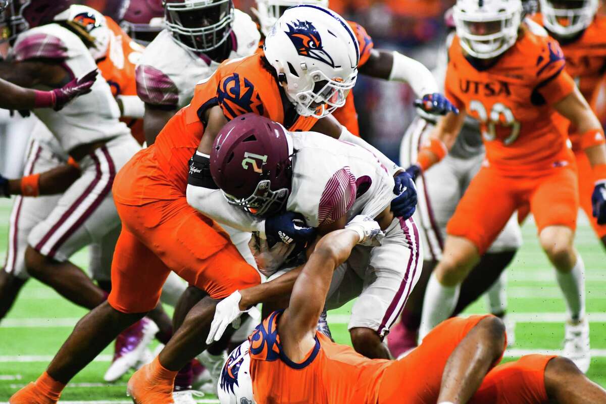 Texas Southern running back Chaunzavia Lewis (21) is brought down in the back field by UTSA linebacker Donyai Taylor (12) during the fourth quarter of Saturday’s game.