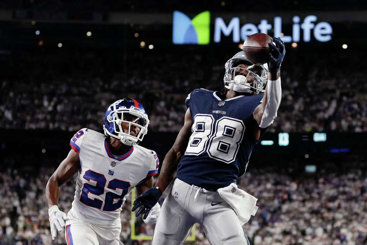 Dallas Cowboys wide receiver CeeDee Lamb (88) makes a catch in the end zone for a touchdown against New York Giants cornerback Adoree' Jackson (22) during the fourth quarter of an NFL football game, Monday, Sept. 26, 2022, in East Rutherford, N.J.