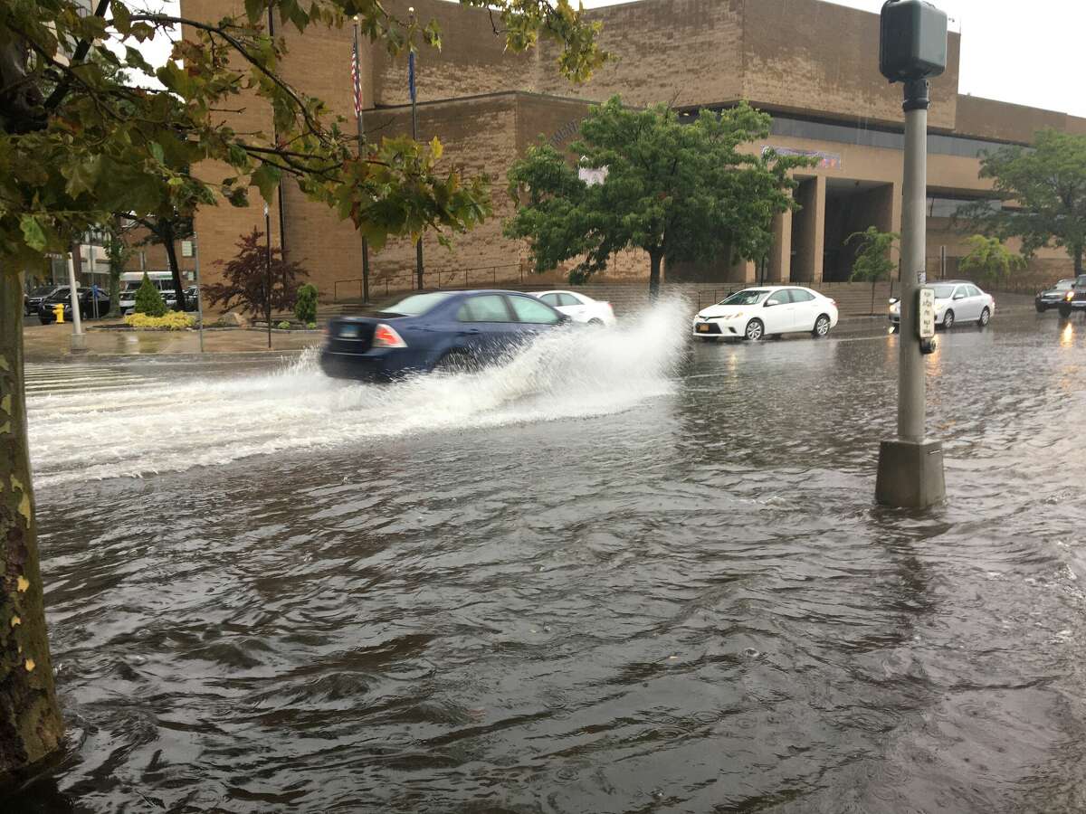 Flooding Tuesday morning along Union Avenue near Police Headquarters and Union Station in New Haven.
