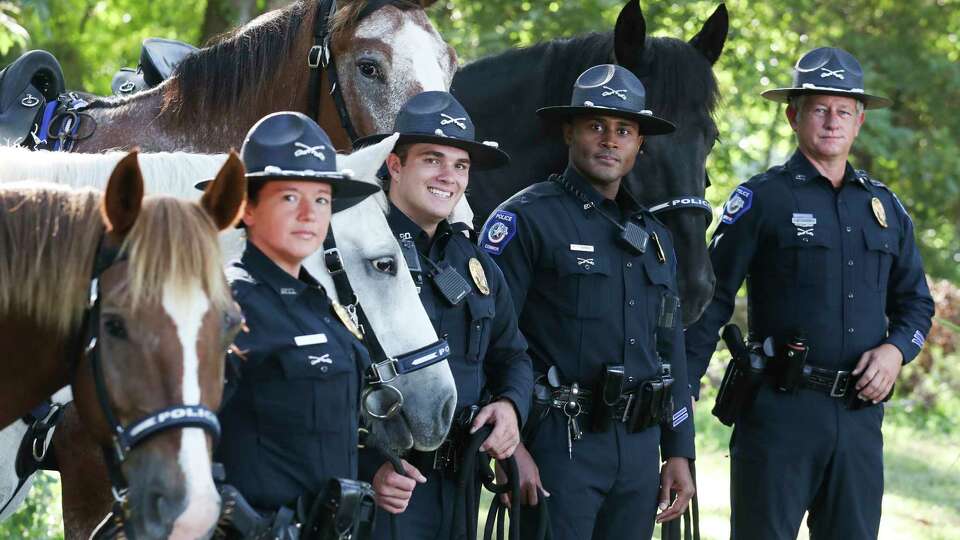 Conroe Police Officers Shana House, Brock Richard, Micheal Chatman and Brian Kosla are four of the five full-time officers of Conroe Police Department's newly formed mounted patrol unit go out for the day, Tuesday, Sept. 27, 2022, in Conroe. The unit provides horse-back police patrols in both neighborhoods, residential, and business areas in Conroe.