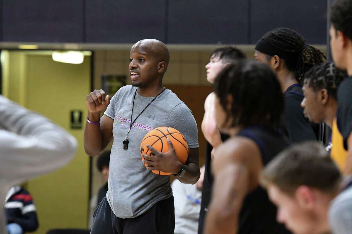 University at Albany head basketball coach Dwayne Killings speaks to players during practice on Tuesday, Sept. 27, 2022, in Albany, N.Y.