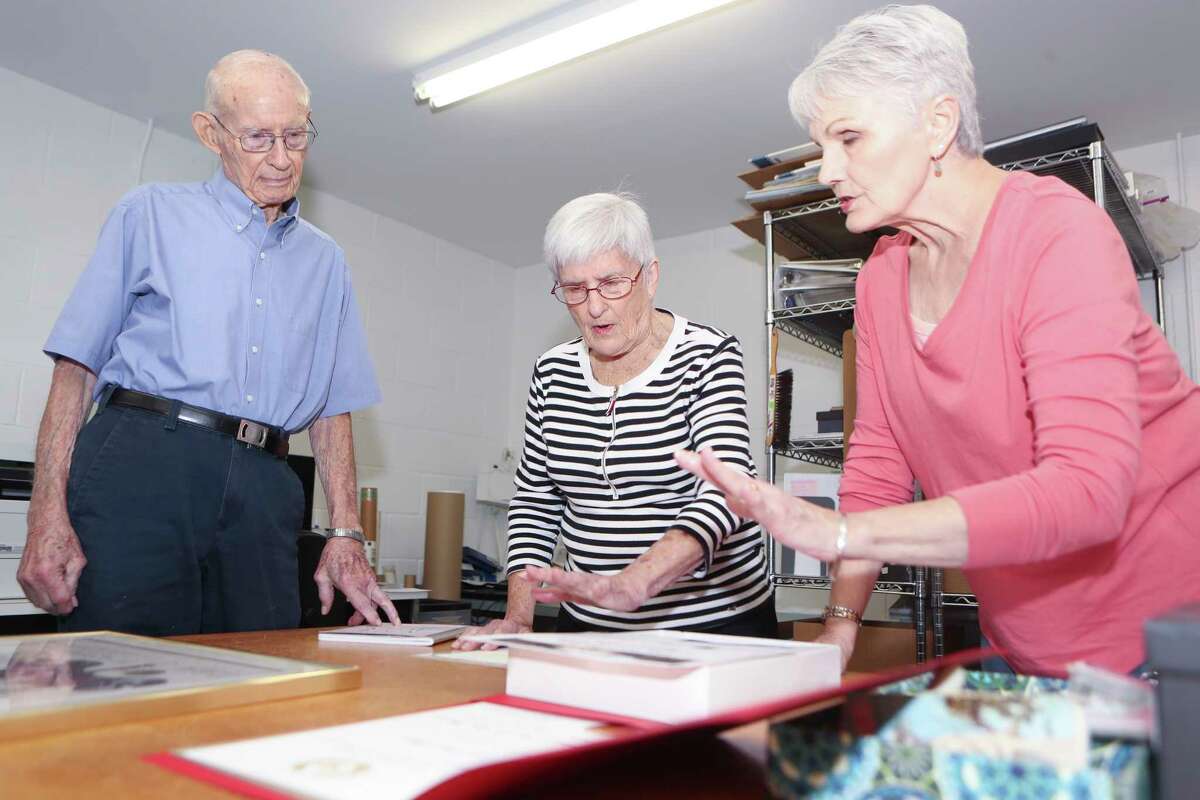 Eugenia Letbetter, center, goes over a donated item with Accessioning Chairman Nancy Kolb, right, and volunteer Homer Wilson at the Heritage Museum of Montgomery County, Tuesday, Sept. 27, 2022, in Conroe. Letbetter was named the organization’s volunteer of the year and has worked on the accessioning committee for more than 10 years.