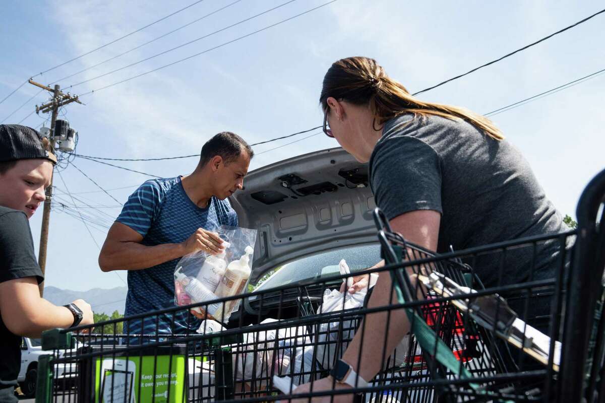 A household receives food from a pantry in Utah. Nationally, the poverty rate is down, but that’s unlikely to last due to an end of pandemic-era policies and a looming recession.