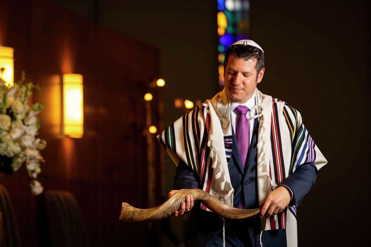 David Scott blows the shofar, a ram’s horn that functions as a trumpet and calls Jewish people to worship for the new year at Congregation Beth Israel on Wednesday, Sept. 8, 2021. Scott is the director of lifelong learning and engagement at the synagogue and official shofar blower.
