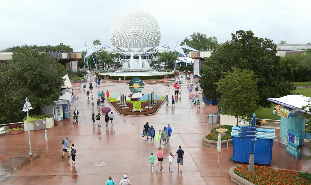 FILE: People leave Epcot after it closed in Orlando, Fla., in preparation for the landfall of Hurricane Matthew, on Oct. 6, 2016. 