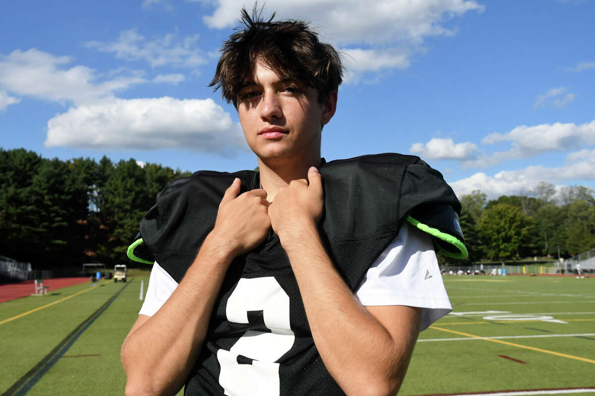 Trumbull quarterback Hunter Agosti poses for a photo at a Trumbull football practice at McDougall Stadium, Trumbull on Tuesday, Sept. 27, 2022.