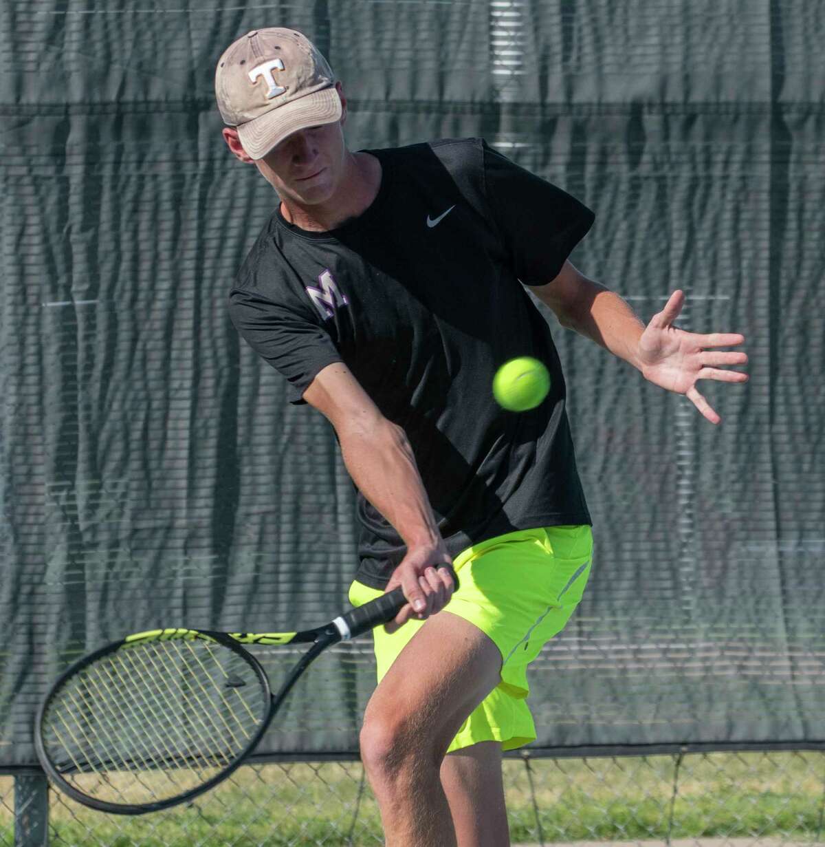 Midland High's Caden Carriger returns a shot during doubles play against Legacy High 09/27/2022 at the Midland High tennis courts. Tim Fischer/Reporter-Telegram