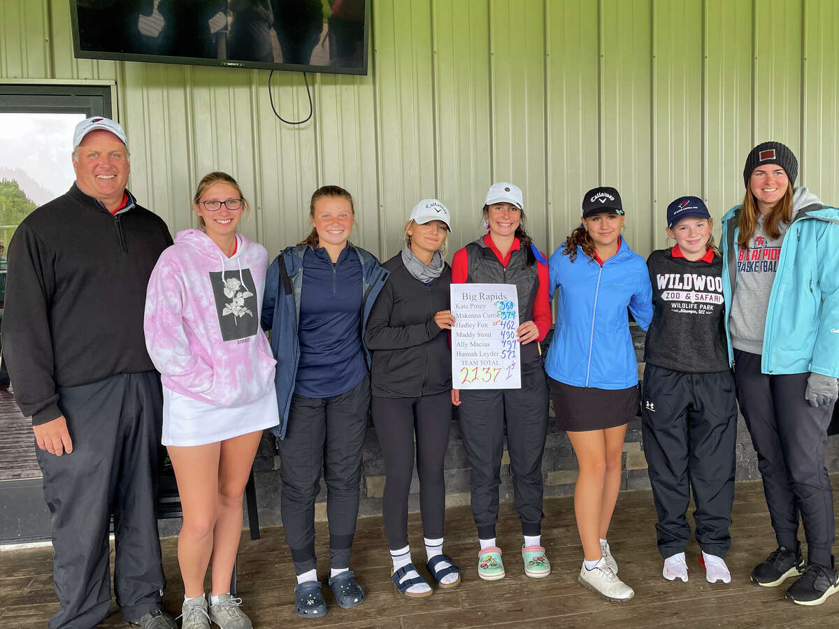 Coach Mark Posey and the Big Rapids girls golf team celebrate the CSAA title. From left: Posey, Ally Macias, Hadley Fox, McKenna Currie, Kate Posey, Maddy Stout, Hannah Leyder and assistant coach Kendra Klein/ Not pictured is Emmalyn Doering.