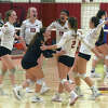 Greenwich volleyball players celebrate a point during their match with Ludlowe in Greenwich on Tuesday, Sept. 27, 2022.