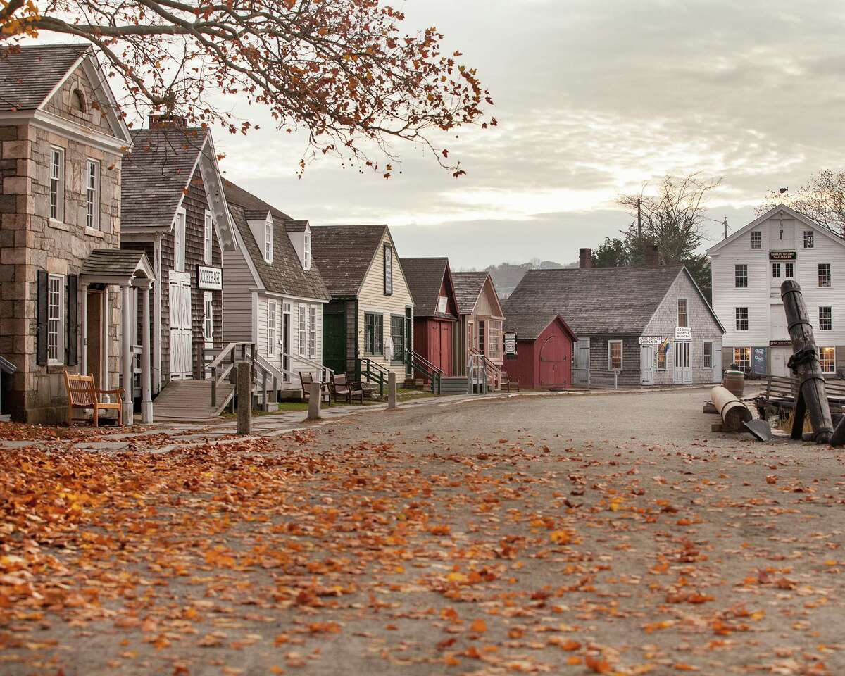 A fall view of Mystic Seaport's street of authentic period buildings.