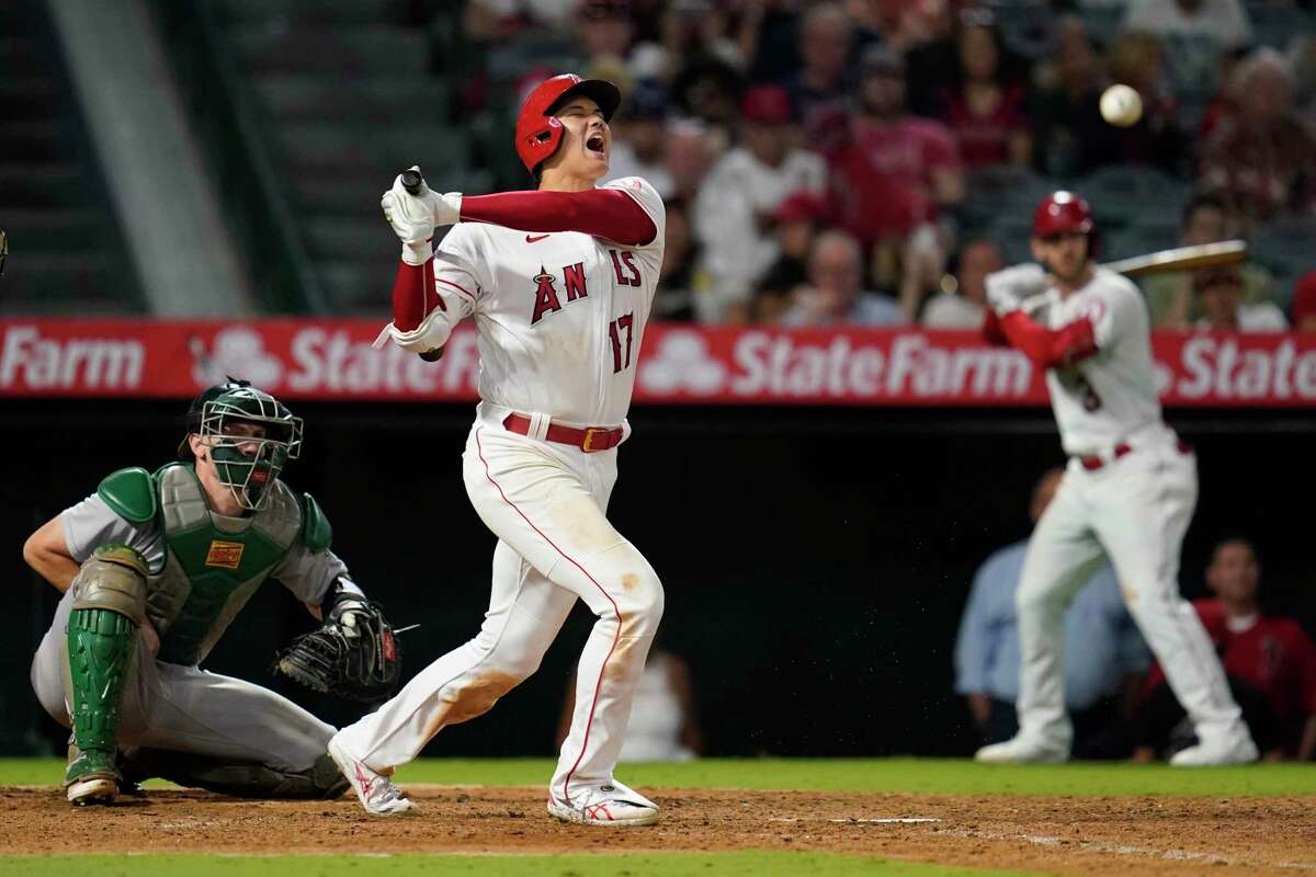 Los Angeles Angels designated hitter Shohei Ohtani (17) reacts after hitting a foul ball during the seventh inning of a baseball game against the Oakland Athletics in Anaheim, Calif., Tuesday, Sept. 27, 2022. (AP Photo/Ashley Landis)