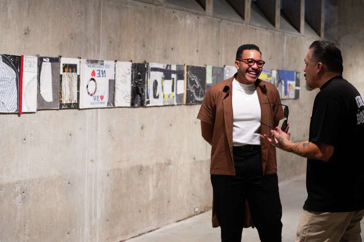 Troy Montes Michie with Ruffian Rob of Chicano Boulevard during a preview party for the artist's first solo exhibition, "Rock of Eye," at Contemporary Arts Museum, Houston.