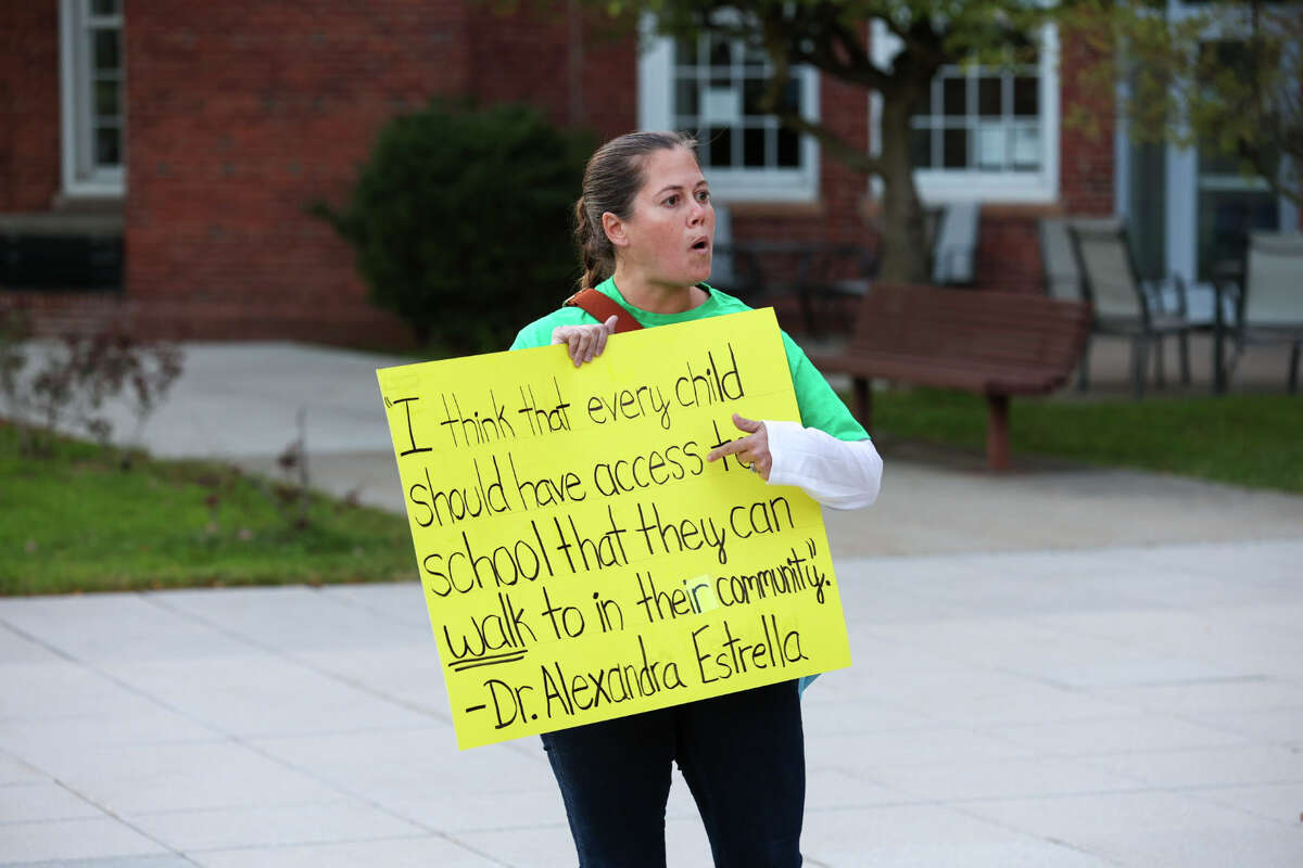Protestors stood outside of Norwalk City Hall on Tuesday, September 27, 2022 to demonstrate their objections to the school district's Middle School Choice program.
