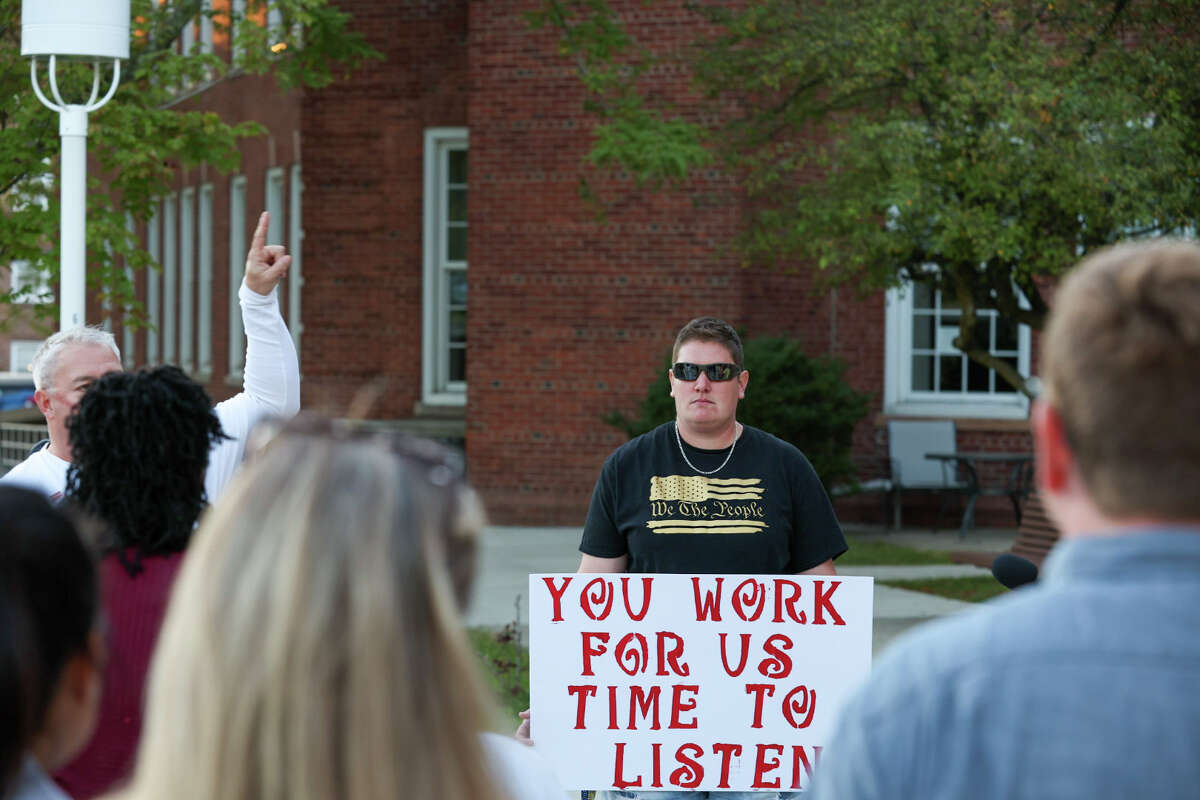 Protestors stood outside of Norwalk City Hall on Tuesday, September 27, 2022 to demonstrate their objections to the school district's Middle School Choice program.