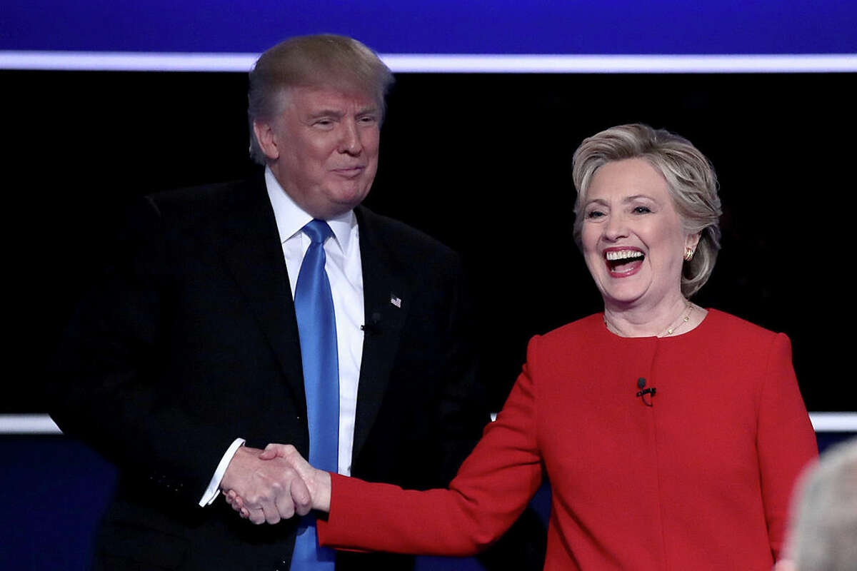 Donald Trump and Hillary Clinton shake hands after the presidential debate at Hofstra University on Sept, 26, 2016, in Hempstead, N.Y.