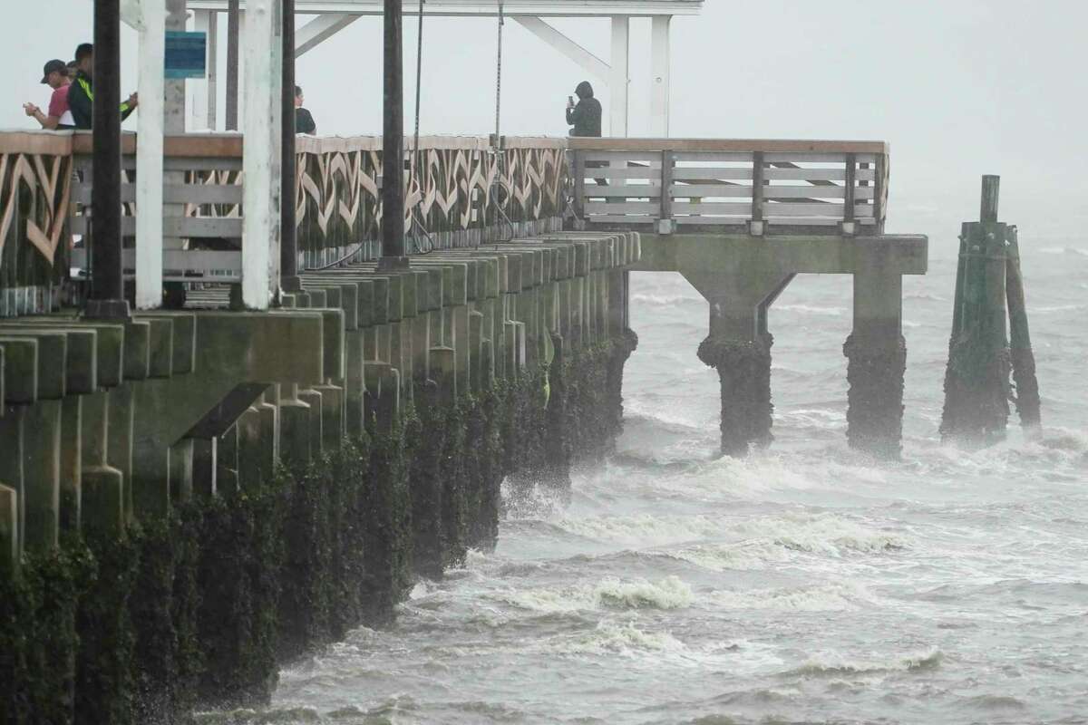 Waves crash along the Ballast Point Pier ahead of Hurricane Ian, Wednesday, Sept. 28, 2022, in Tampa, Fla. The U.S. National Hurricane Center says Ian's most damaging winds have begun hitting Florida's southwest coast as the storm approaches landfall.