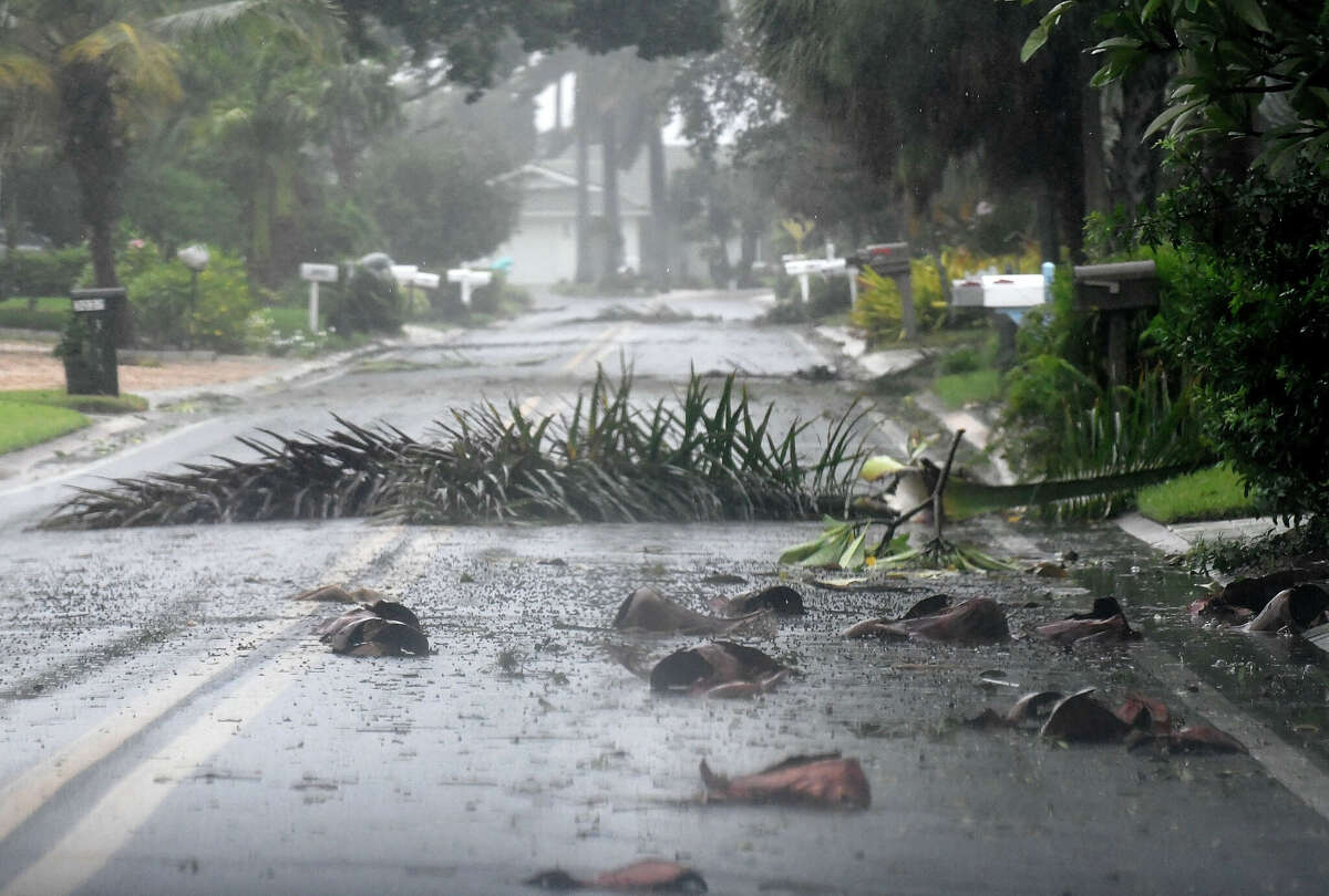 Debris litters a street in a neighborhood of St. Pete Beach as the winds from Hurricane Ian arrive on September 28, 2022 in St. Petersburg, Florida. Ian is hitting the area as a Category 4 hurricane. 