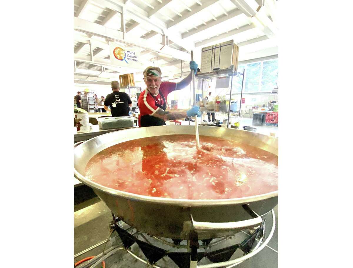 Matthew Rorick, owner of Forlorn Hope Wines, stirs a pot of borscht that will feed 200 Ukrainian refugees while volunteering with World Central Kitchen in July.