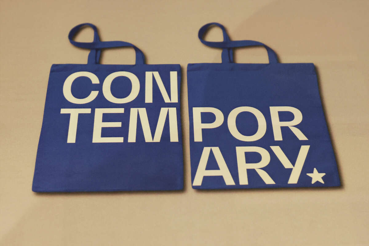 A pair of tote bags bearing the new logo of the Contemporary at Blue Star.