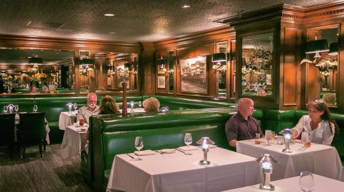 People dine at the Big 4 restaurant inside S.F.'s Huntington Hotel on Nob Hill in 2014. The restaurant is closed until further notice. 