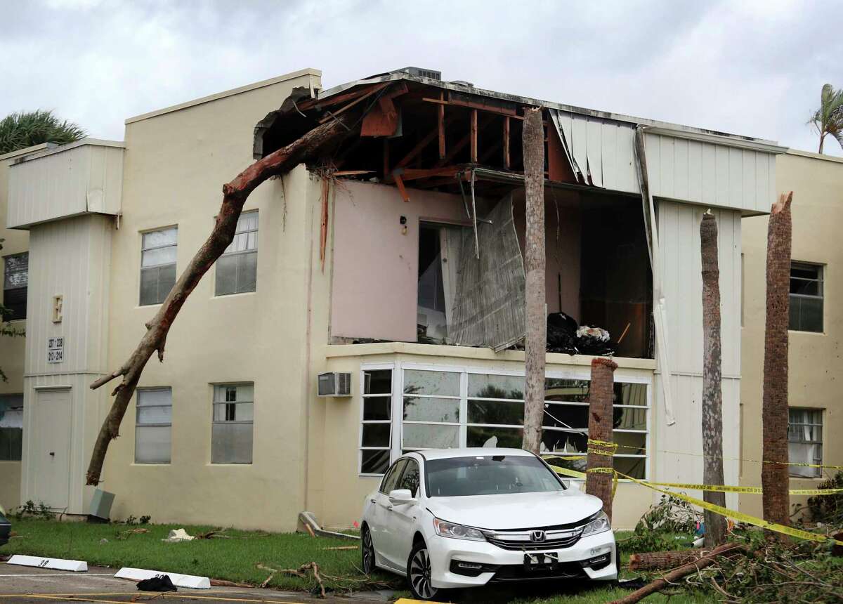 A damaged apartment from an apparent overnight tornado spawned from Hurricane Ian at Kings Point 55+ community in Delray Beach, Fla., on Wednesday, Sept. 28, 2022. The U.S. National Hurricane Center says Ian's most damaging winds have begun hitting Florida's southwest coast as the storm approaches landfall. (Carline Jean /South Florida Sun-Sentinel via AP)