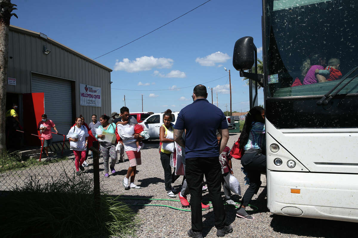 Migrants board a Chicago-bound bus provided by Gov. Greg Abbott's office, at Mission: Border Hope in Eagle Pass, Texas, Thursday, Sept. 22, 2022. The bus was scheduled for a day earlier but didn't have enough migrants interested.