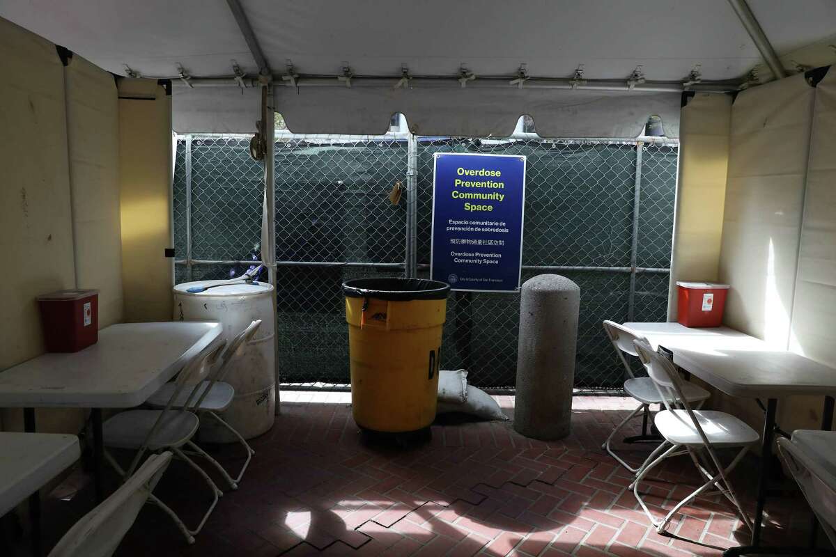 Sharps containers are seen on tables with chairs in the overdose prevention space at the Tenderloin Center on Thursday, June 2, 2022 in San Francisco, Calif.
