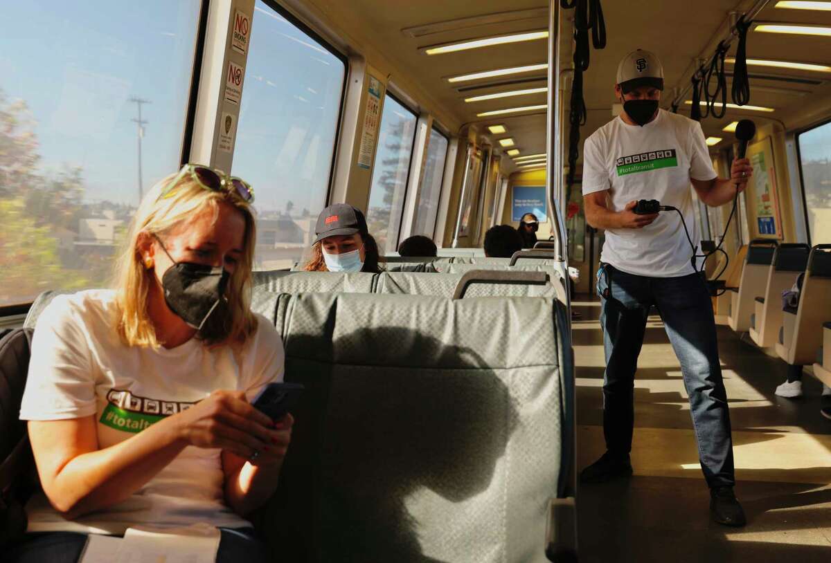 San Francisco Chronicle columnist Heather Knight and culture critic Peter Hartlaub ride a BART train from awl Cerrito Del Norte Station to MacArthur Station in Oakland, Calif. Wednesday, September 28, 2022 during their attempt to ride all of the Bay Area's 27 transit agencies in one day.