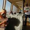 San Francisco Chronicle columnist Heather Knight and culture critic Peter Hartlaub ride a BART train from awl Cerrito Del Norte Station to MacArthur Station in Oakland, Calif. Wednesday, September 28, 2022 during their attempt to ride all of the Bay Area's 27 transit agencies in one day.