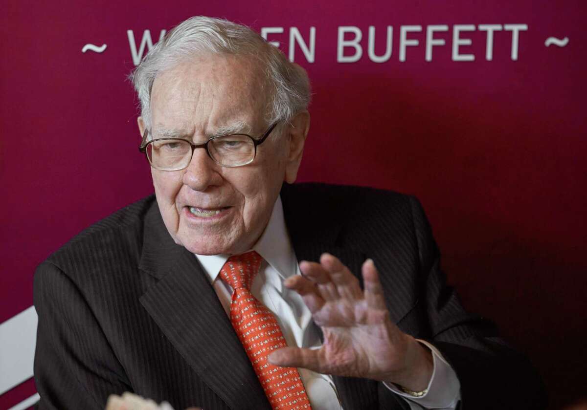 FILE - In this May 5, 2019, file photo, Warren Buffett, Chairman and CEO of Berkshire Hathaway, speaks during a game of bridge following the annual Berkshire Hathaway shareholders meeting in Omaha, Neb. Warren Buffett's company picked up another $368 million worth of Occidental Petroleum stock this week to give it control of nearly 21% of the oil producer.