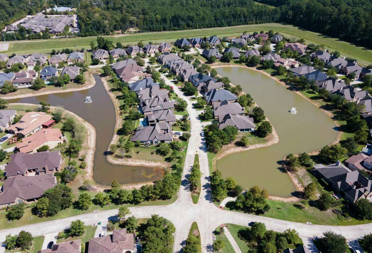 The water level around Kayak Ridge Pond Park is seen, Wednesday, Sept. 28, 2022, in Spring. The Woodlands Township is considering the cost to add water to the pond and other similar bodies of water after numerous resident complaints.