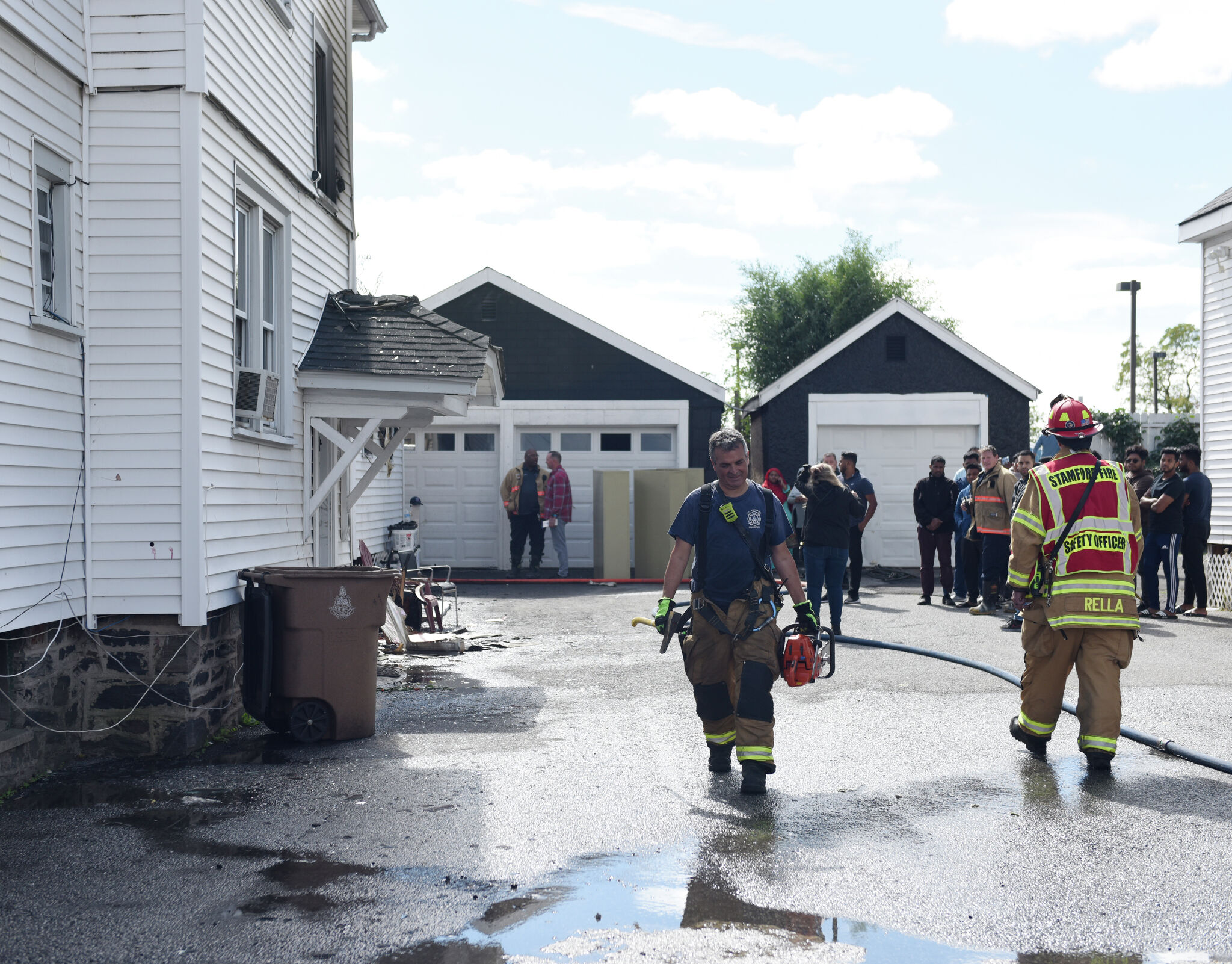 Stamford police rescue 5, including infant, from burning home