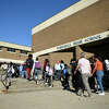 Students enter Westhill High School in Stamford, Conn. Thursday, Sept. 29, 2022.