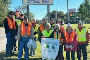 Senior softballers pitch in for highway cleanup