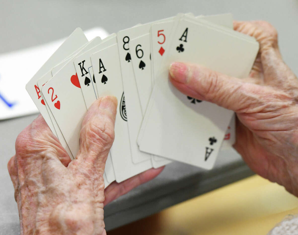 Players take part in a game of bridge at the YWCA Greenwich on July 1, 2019. 