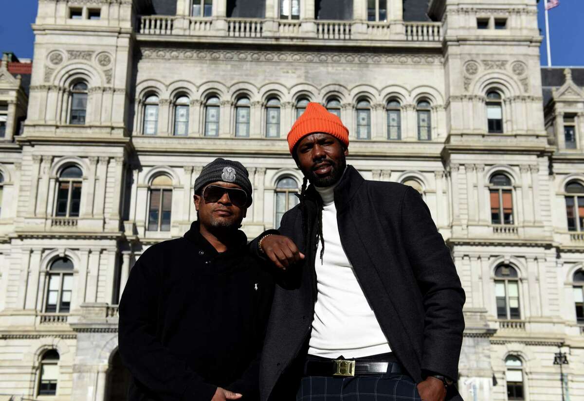 Saladin Amir, left, and Amin Cowan, right, stand outside the Capitol on Thursday, Sept. 29, 2022, at Empire State Plaza in Albany, N.Y. Amin applied for a dispensary license through CAURD program for former justice-involved individuals after encouragement from Saladin.