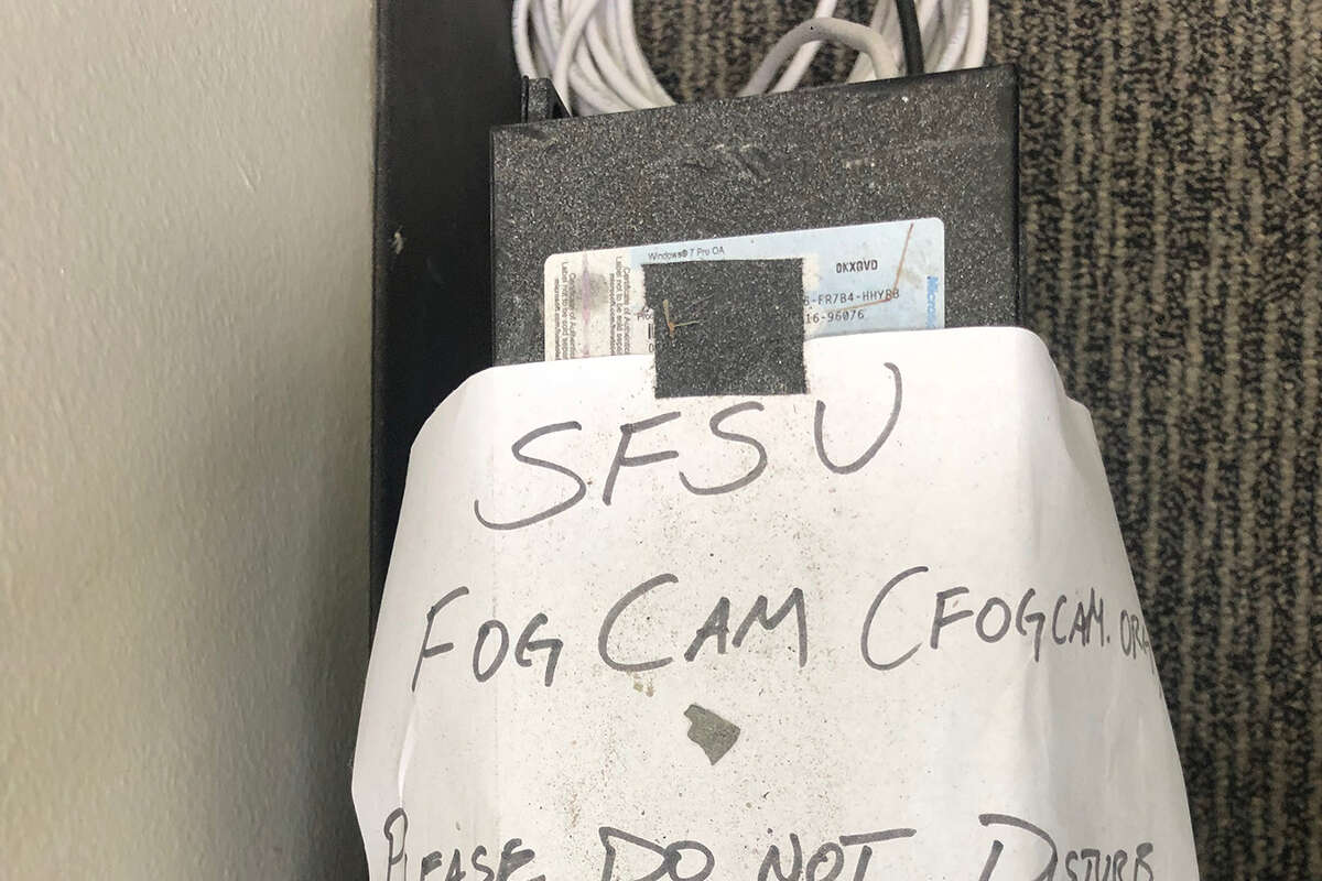 The dusty and battered hand-written note in the Business building informing people not to mess with the Fogcam.