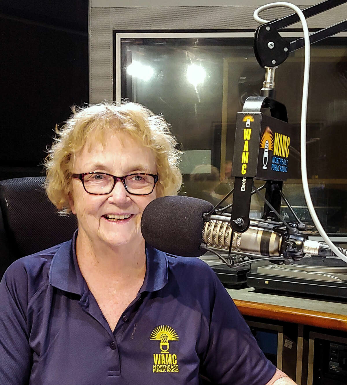 Wanda Fischer in the studio of WAMC Northeast Public Radio during a 2022 broadcast of "The Hudson River Sampler," a folk-music program she has hosted since 1982.