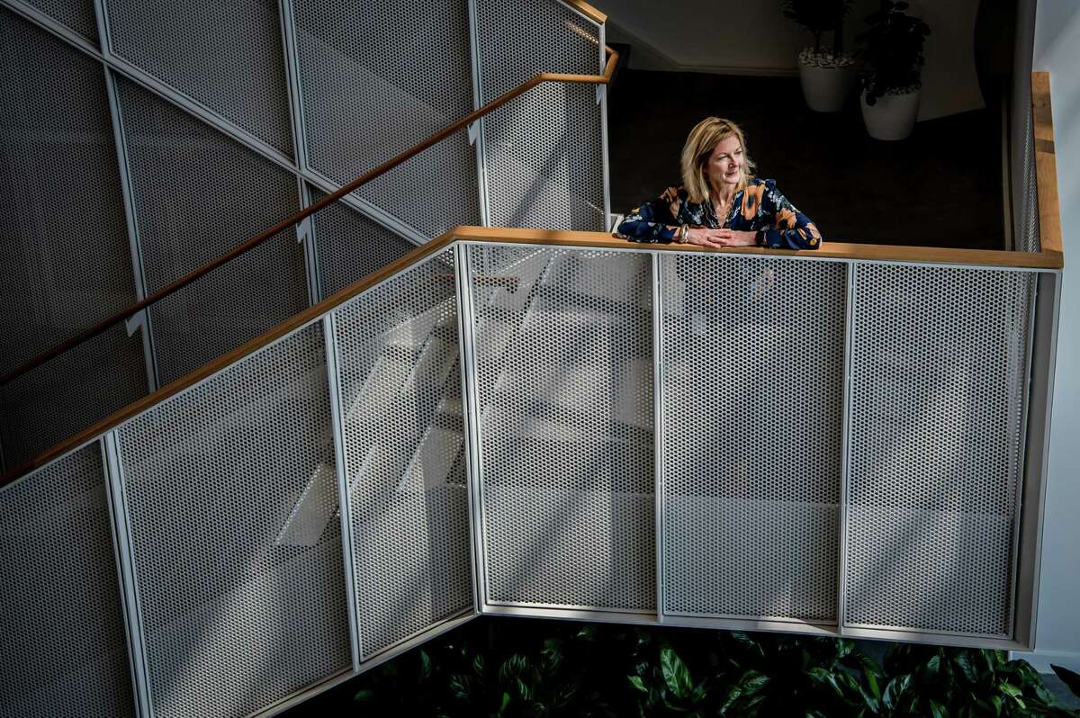 Houston Endowment President and CEO Ann Stern looks over the lobby  of the new Houston Endowment building.