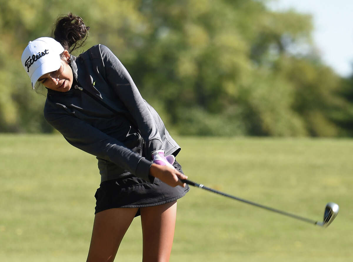 Edwardsville's Ruhee Gupchup follows through during the Class 2A Collinsville Regional on Thursday at Arlington Greens Golf Course in Granite City.