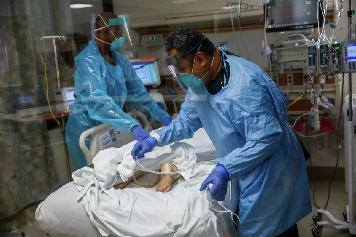 Nurses attend to a COVID-19 patient in the ICU at Regional Medical Center of San Jose in December, 2020.
