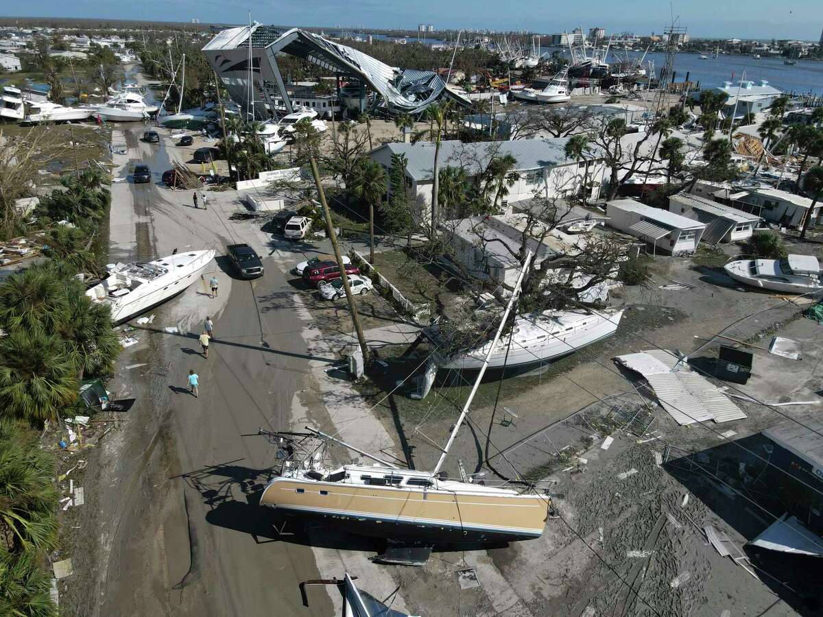 In this photo taken by a drone, boats lie scattered amidst mobile homes after the passage of Hurricane Ian, on San Carlos Island, in Fort Myers Beach, Fla., Thursday, Sept. 29, 2022.