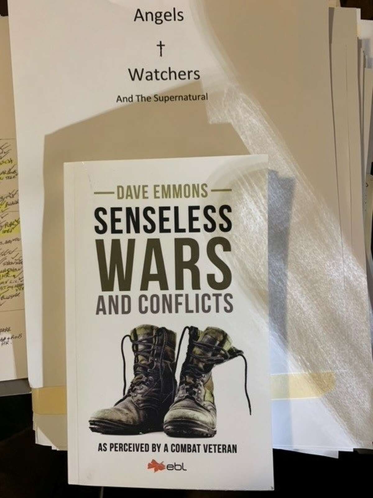 “Senseless Wars and Conflicts: As Perceived by a Combat Veteran,” by Dave Emmons, is available where most books are sold. A hard copy manuscript of “Angels and Watchers” is upright behind a copy of the newly published book. “Angels and Watchers,” by Emmons, is almost complete and about the supernatural. Emmons will do a signing of “Senseless Wars and Conflicts" from 9 a.m.-noon Saturday, Oct. 8, at Hayner Public Library, 326 Belle St., in Alton.