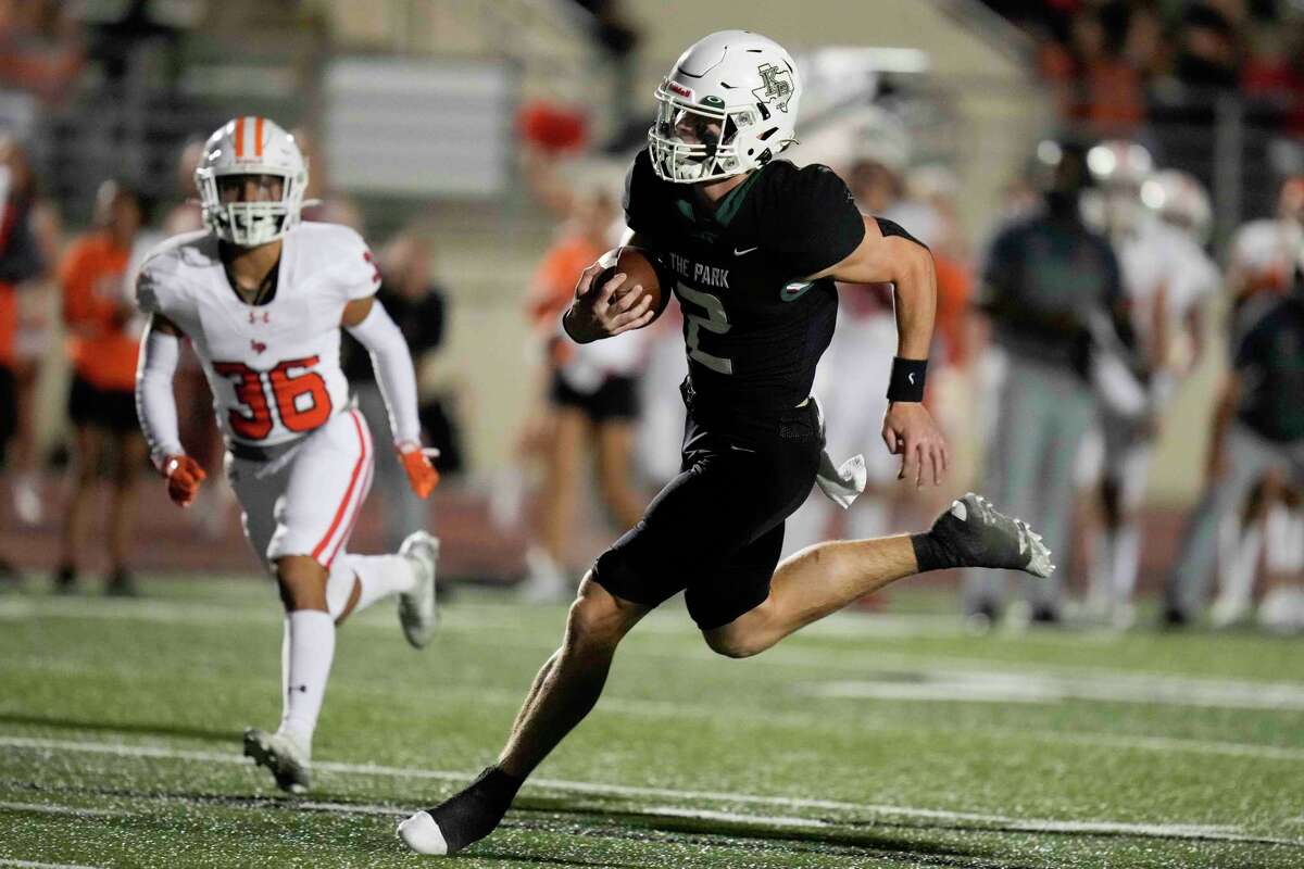 Kingwood Park quarterback Patrick Overmyer, right, runs for a touchdown during the second half of a high school football game against La Porte, Thursday, Sept. 29, 2022, in Humble, TX.