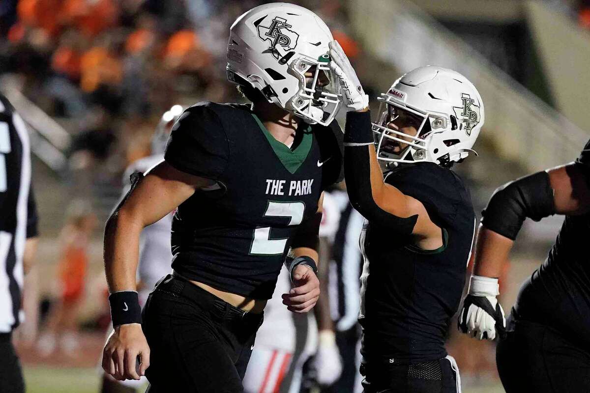 Kingwood Park quarterback Patrick Overmyer, left, celebrates his touchdown with Pierce Richards during the second half of a high school football game against La Porte, Thursday, Sept. 29, 2022, in Humble, TX.