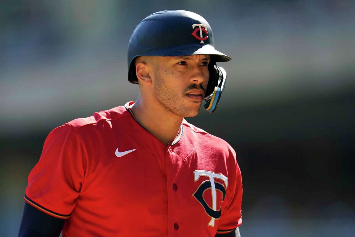 Minnesota Twins' Carlos Correa reacts while batting during the first inning of a baseball game against the Chicago White Sox, Thursday, Sept. 29, 2022, in Minneapolis. (AP Photo/Abbie Parr)