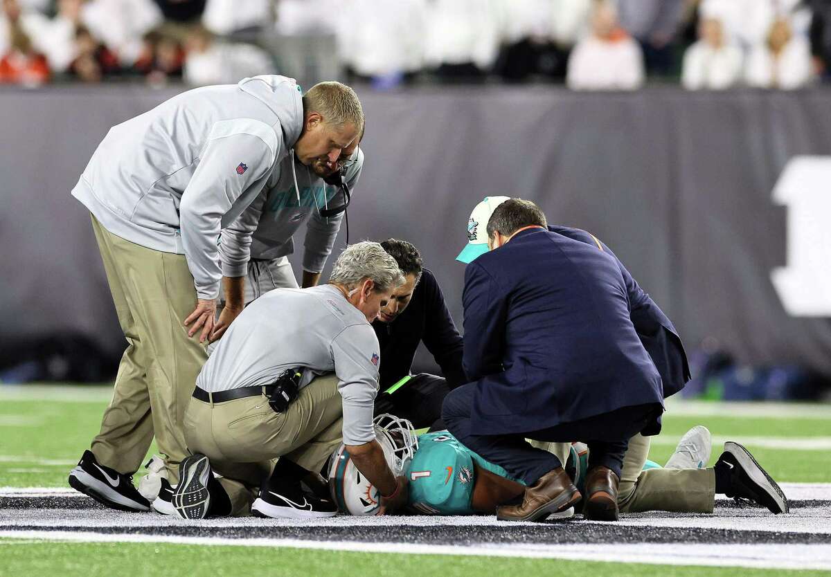 Medical staff tend to Miami Dolphins quarterback Tua Tagovailoa (1) after an injury during the second quarter against the Cincinnati Bengals at Paycor Stadium on Thursday, Sept. 29, 2022, in Cincinnati. (Andy Lyons/Getty Images/TNS)