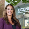 UConn School of Social Work professor Cristina Wilson poses for a photo in front of the School of Social Work Building on the UConn Hartford campus on Sept. 1, 2022. (Sydney Herdle/UConn Photo)