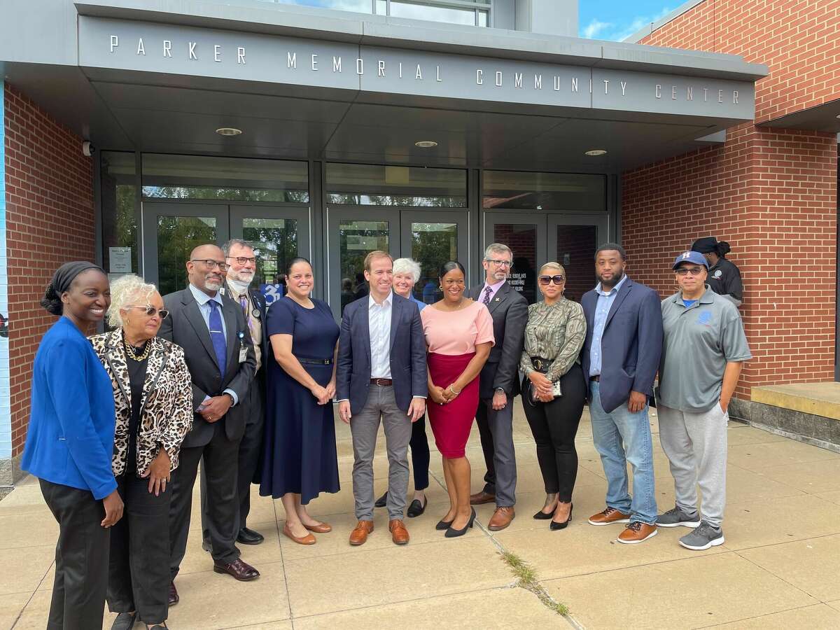 Local officials and community members pose at an event to promote Saturday's wellness fair in Hartford.