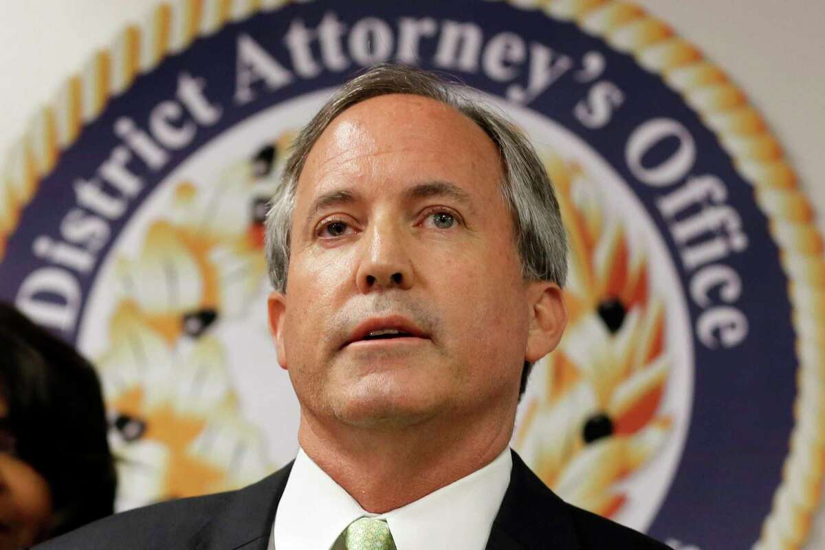 FILE - In this June 22, 2017 file photo, Texas Attorney General Ken Paxton speaks at a news conference in Dallas. As Paxton seeks to fend off legal troubles and win a third term as Texas' top law enforcement official, his agency has come unmoored by disarray behind the scenes, with seasoned lawyers quitting over practices they say aim to slant legal work, reward loyalists and drum out dissent.